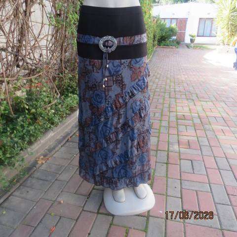 Floral fully lined polyester frilled skirt with black yoke and buckle, size 36
