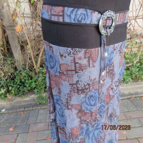 Floral fully lined polyester frilled skirt with black yoke and buckle, size 36