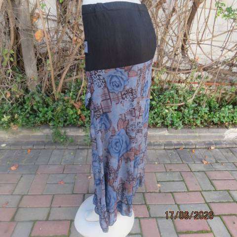 Floral fully lined polyester frilled skirt with black yoke and buckle, size 36