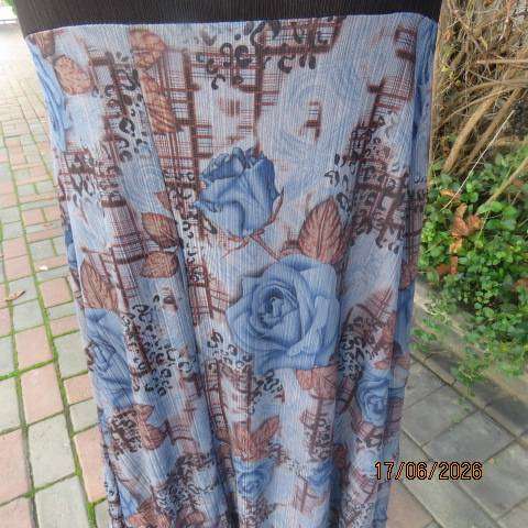 Floral fully lined polyester frilled skirt with black yoke and buckle, size 36