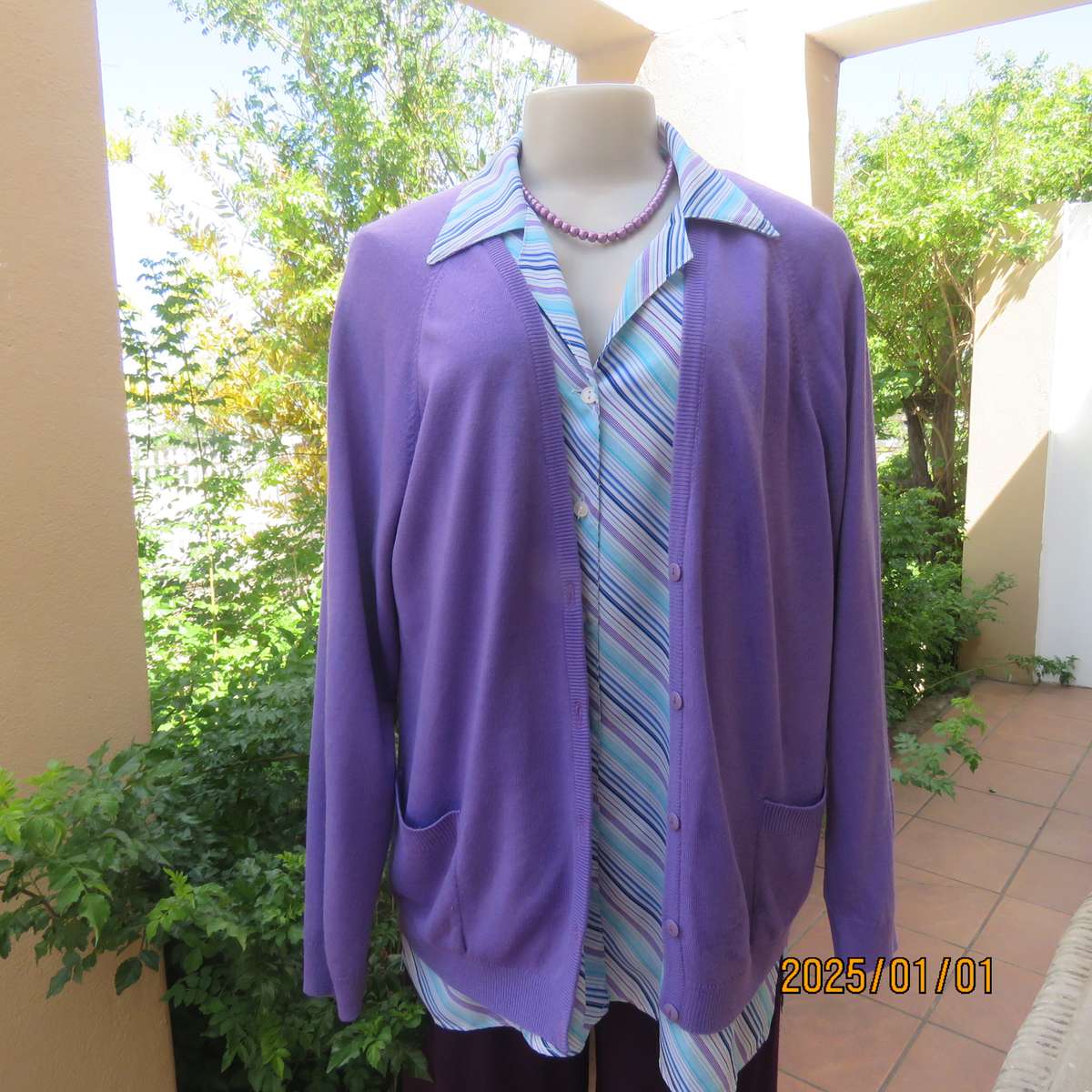 Comfy jacaranda colour acrylic knit long raglan sleeve button down cardigan. Size 40. Two pockets.