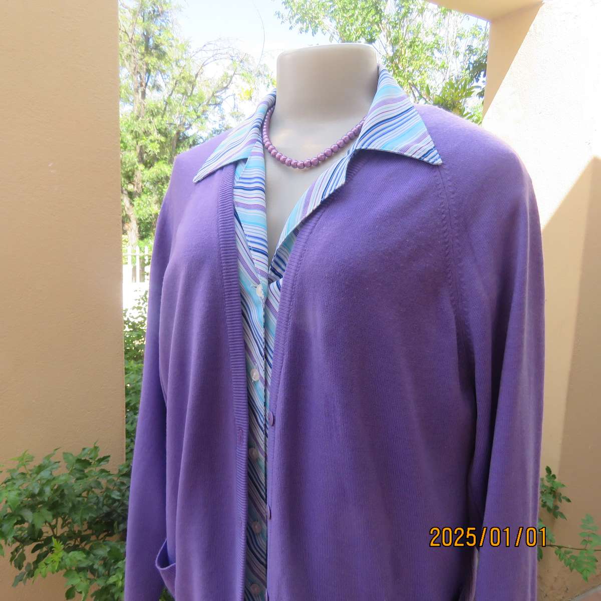 Comfy jacaranda colour acrylic knit long raglan sleeve button down cardigan. Size 40. Two pockets.