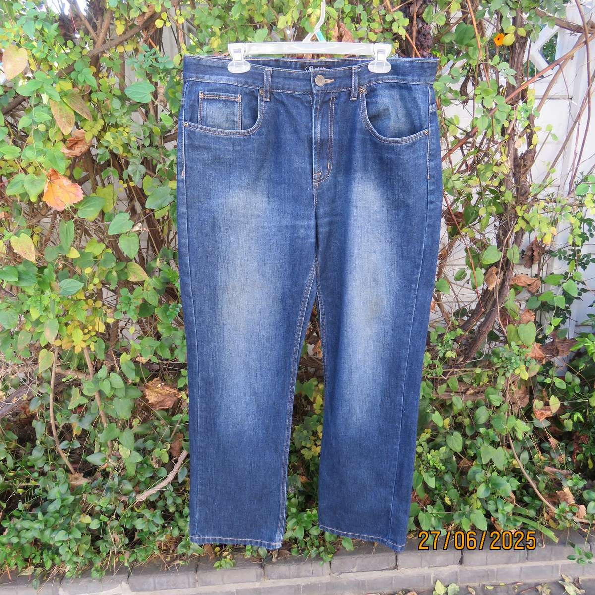 Men's blue denim polycotton straight legged jeans in size 36.