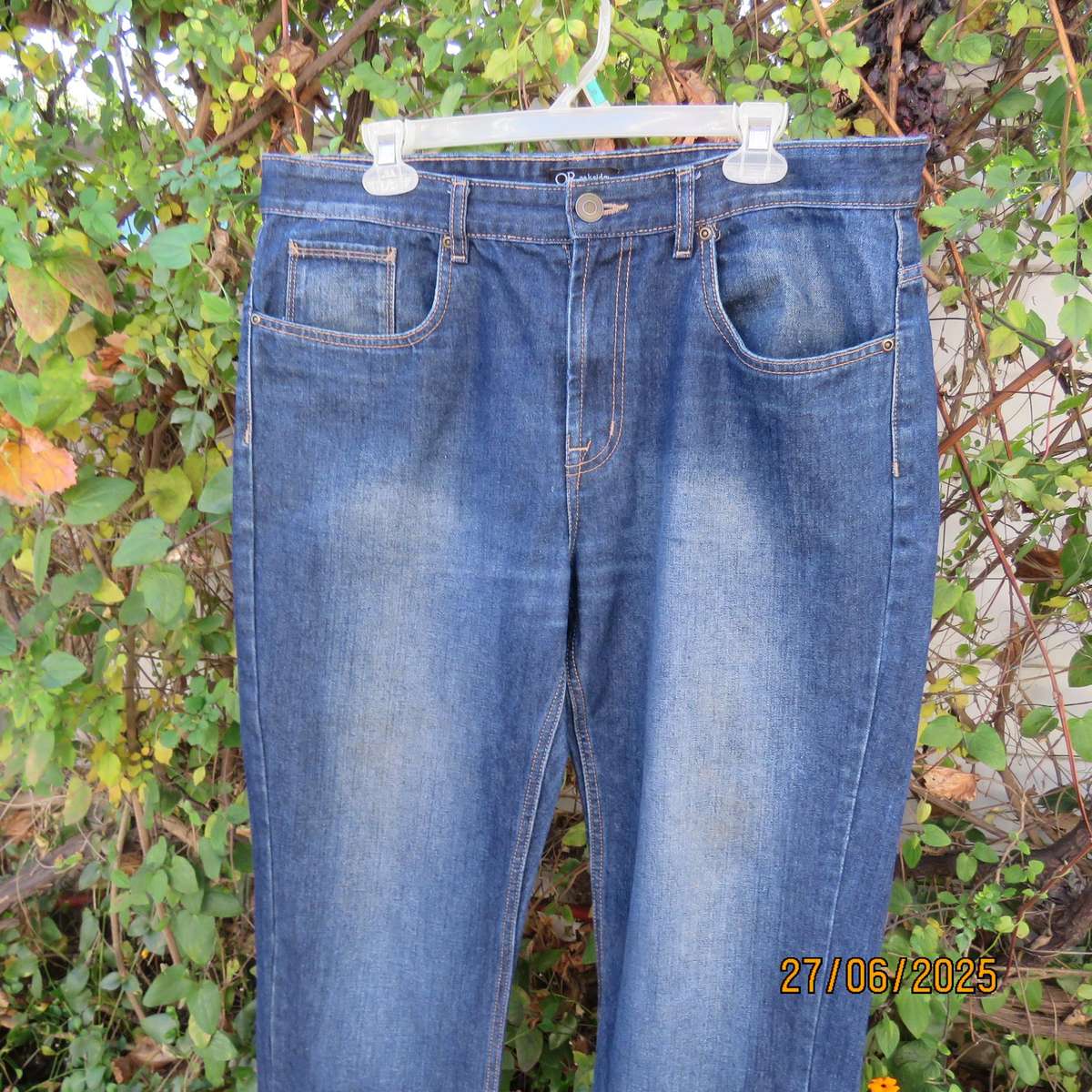 Men's blue denim polycotton straight legged jeans in size 36.
