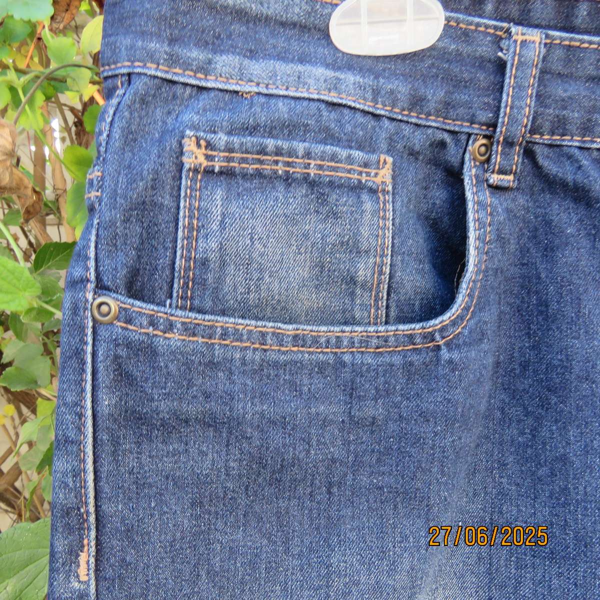 Men's blue denim polycotton straight legged jeans in size 36.
