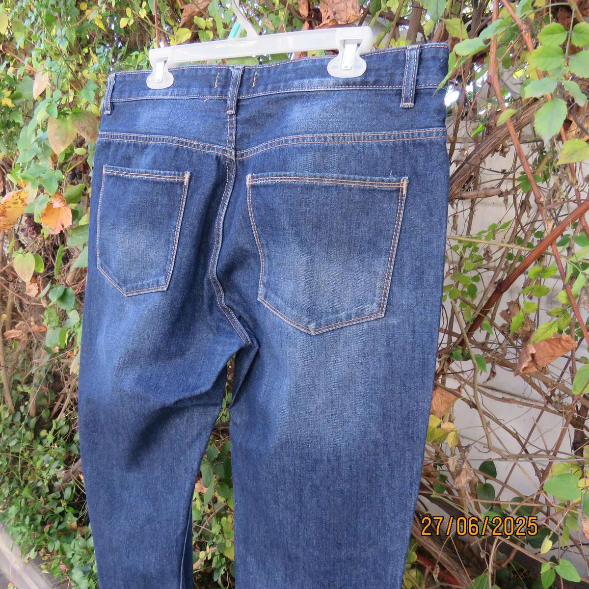 Men's blue denim polycotton straight legged jeans in size 36.