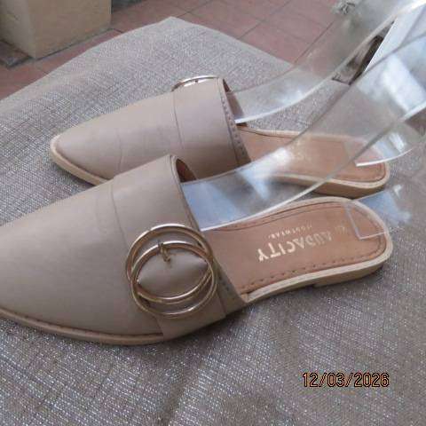 Audacity beige slip-on flats with pointed fronts and buckle detail, size 5