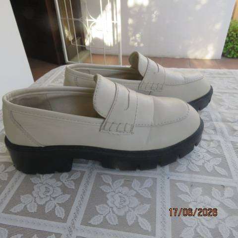 Ladies white chunky loafers in PU with thick black soles and heels, size 7