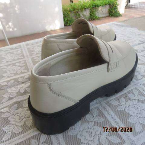 Ladies white chunky loafers in PU with thick black soles and heels, size 7