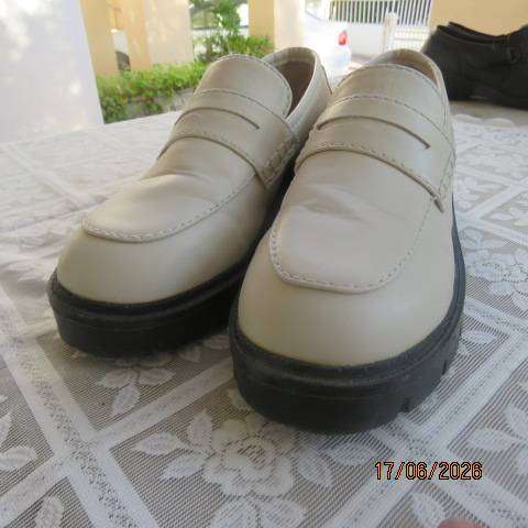 Ladies white chunky loafers in PU with thick black soles and heels, size 7