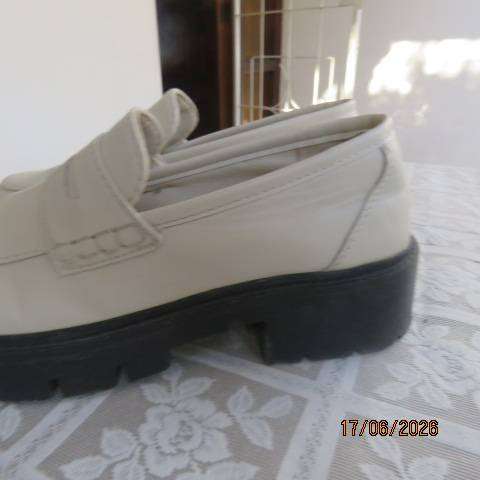 Ladies white chunky loafers in PU with thick black soles and heels, size 7
