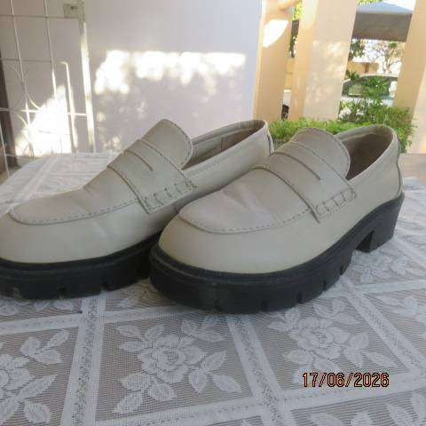 Ladies white chunky loafers in PU with thick black soles and heels, size 7