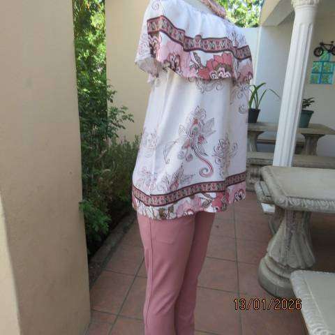 White with pink and light brown floral design slip over top. Wide elasticated collar. Size 36