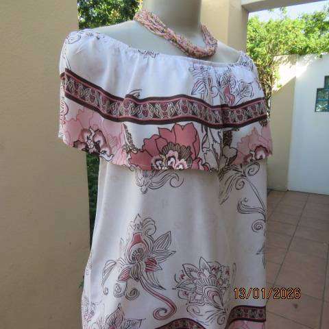 White with pink and light brown floral design slip over top. Wide elasticated collar. Size 36