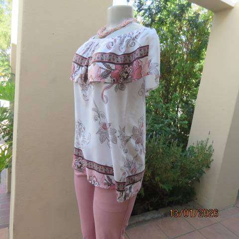 White with pink and light brown floral design slip over top. Wide elasticated collar. Size 36