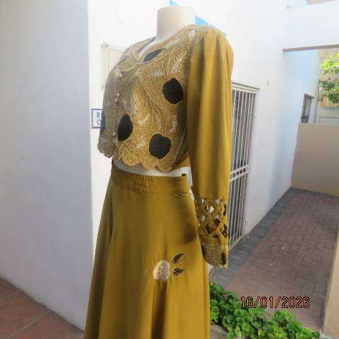Boutique made 3 pc Islamic marigold colour silky polyester outfit with rich embellishment. Size 38