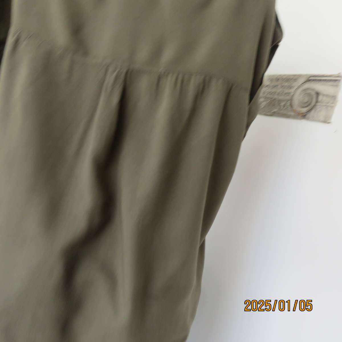 Army green viscose sleeveless button down top. Shirt collar. Flap pockets. Small epaulettes.Size 40.