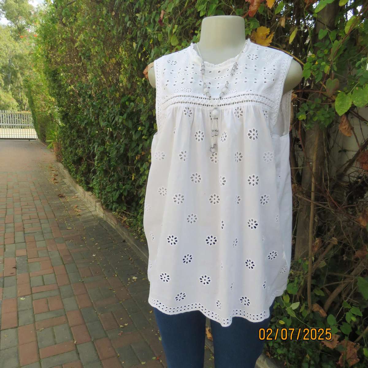 REAL WOMAN white fine cotton sleeveless top with eyelet embroidery on front. Size 40