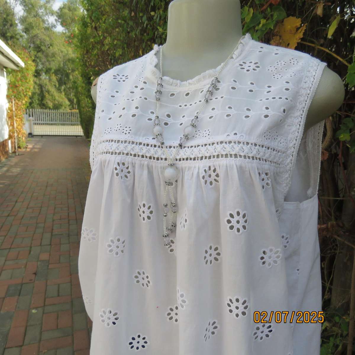 REAL WOMAN white fine cotton sleeveless top with eyelet embroidery on front. Size 40