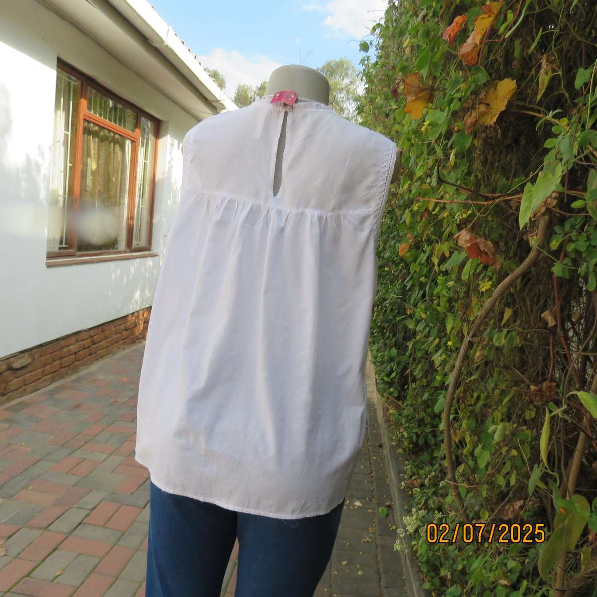 REAL WOMAN white fine cotton sleeveless top with eyelet embroidery on front. Size 40