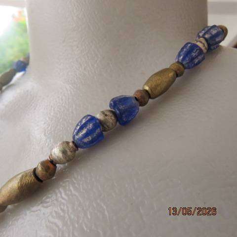 Ethnic beaded necklace with blue and gold beads and copper pendant