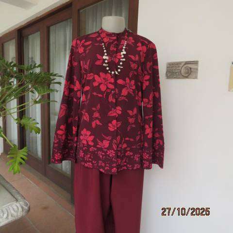 Maroon long sleeve polyester top with crimson flowers and banded collar. Size 34