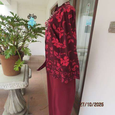 Maroon long sleeve polyester top with crimson flowers and banded collar. Size 34