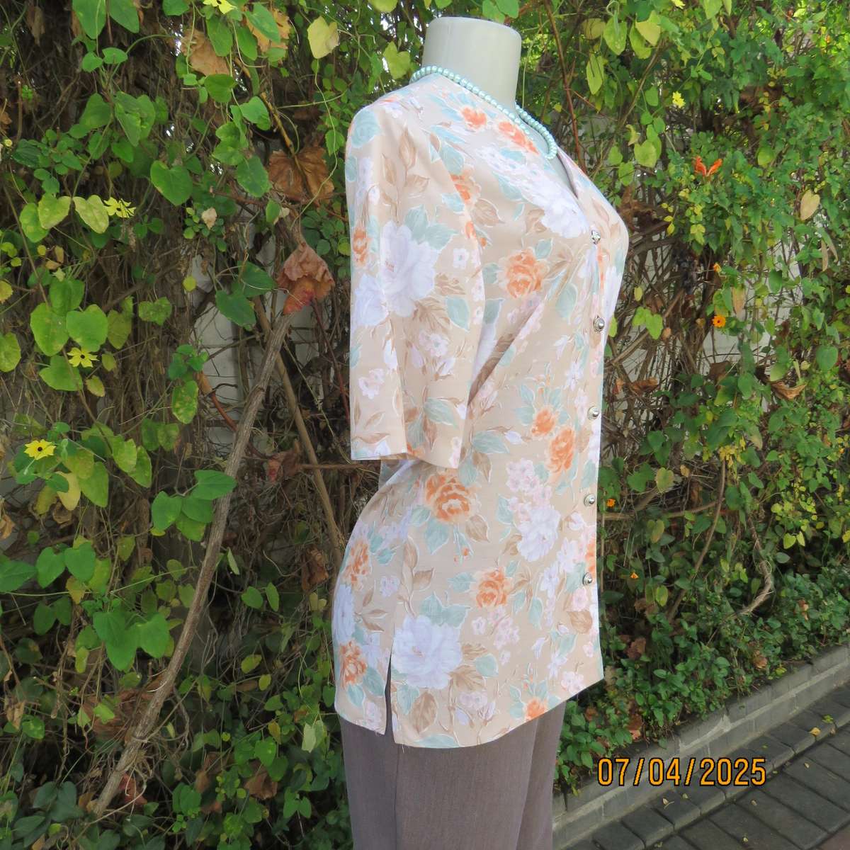 WOOLWORTHS oatmeal colour V front button down top. With peach-lilac flowers. Size 34