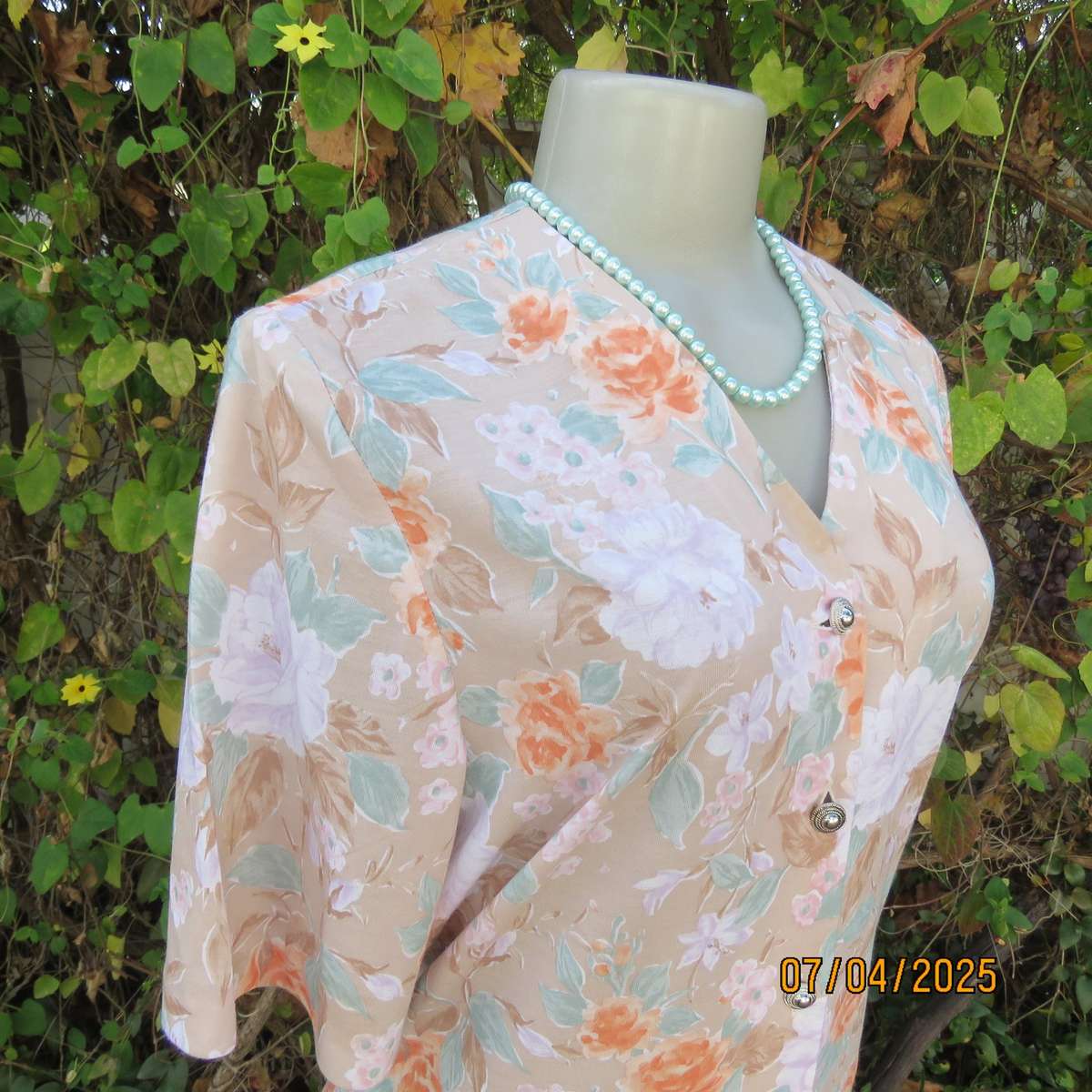 WOOLWORTHS oatmeal colour V front button down top. With peach-lilac flowers. Size 34