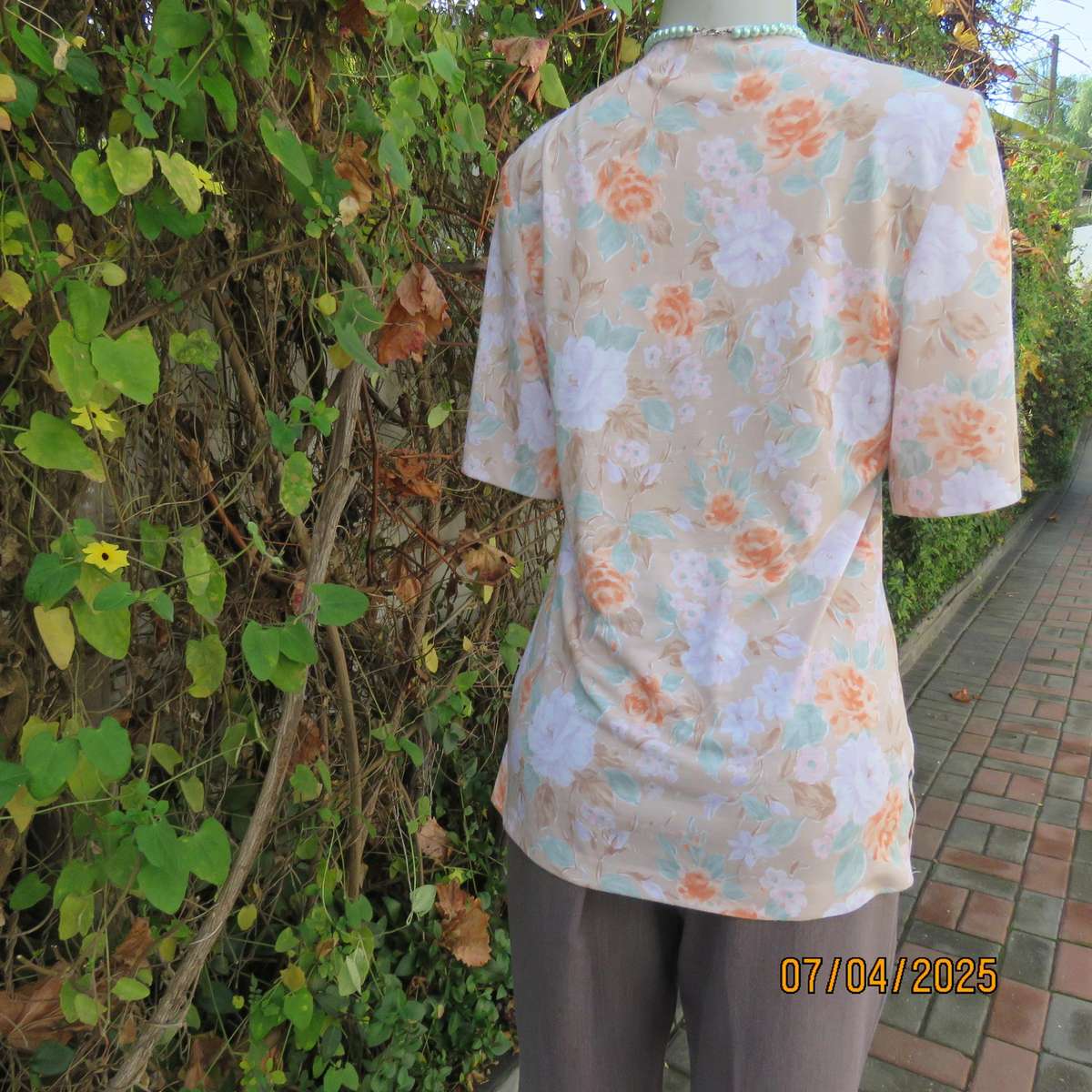 WOOLWORTHS oatmeal colour V front button down top. With peach-lilac flowers. Size 34