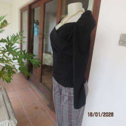 SHEIN long sleeve black stretch polyester long sleeve top with elastic shoulders. Size 34-36
