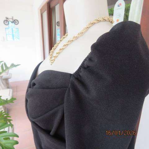 SHEIN long sleeve black stretch polyester long sleeve top with elastic shoulders. Size 34-36