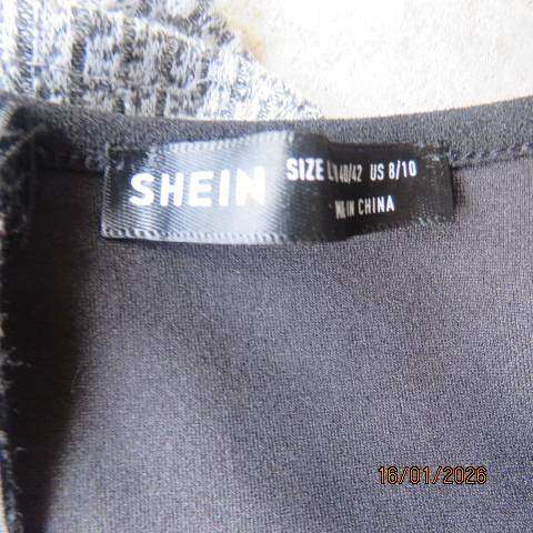 SHEIN long sleeve black stretch polyester long sleeve top with elastic shoulders. Size 34-36