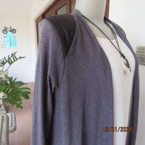 Ash grey long sleeve cover-up with black leather look shoulder-back inlays. Waterfall style. Size 32