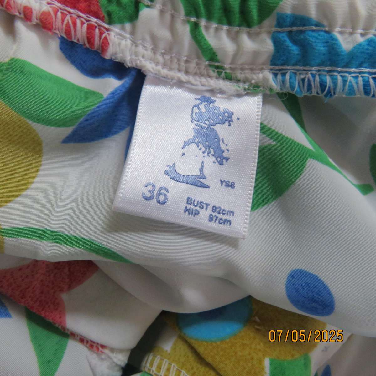 FASHIONETTE silky white polyester paneled A-line floral skirt. Elasticated back. Size 42