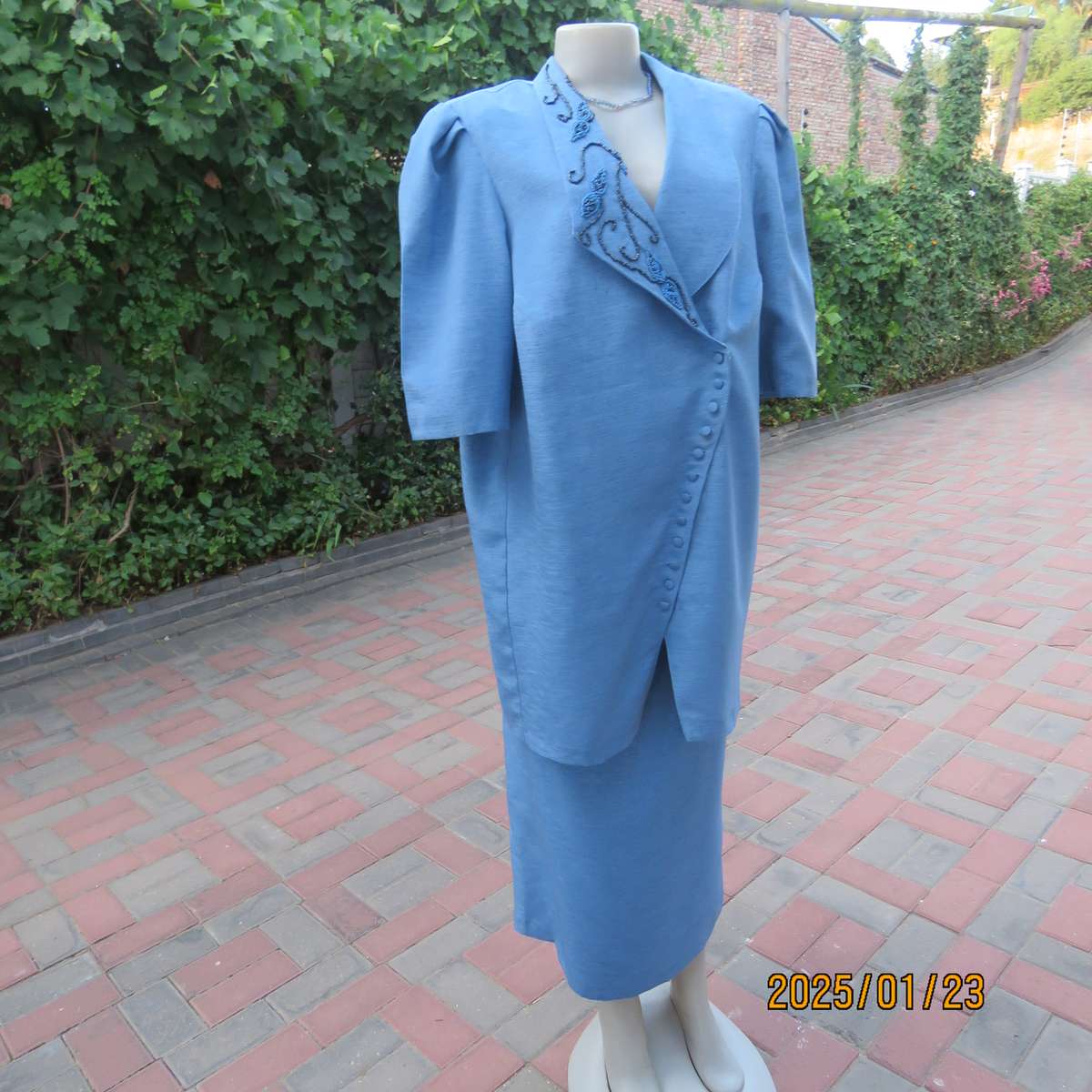 Boutique made 2 pc steel blue textured satin fully lined skirt suit. With embellished collar.Size 42