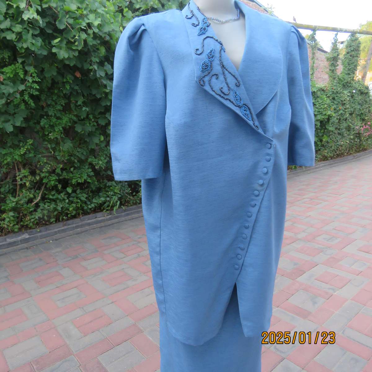 Boutique made 2 pc steel blue textured satin fully lined skirt suit. With embellished collar.Size 42