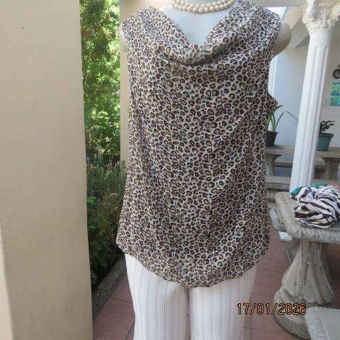 JUDY'S PRIDE animal print sheer polyester with brown stretch poly lining. Cowl neckline. Size 38
