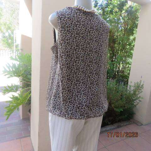 JUDY'S PRIDE animal print sheer polyester with brown stretch poly lining. Cowl neckline. Size 38