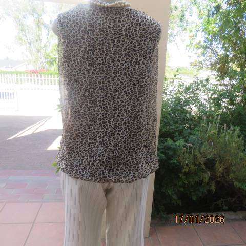 JUDY'S PRIDE animal print sheer polyester with brown stretch poly lining. Cowl neckline. Size 38