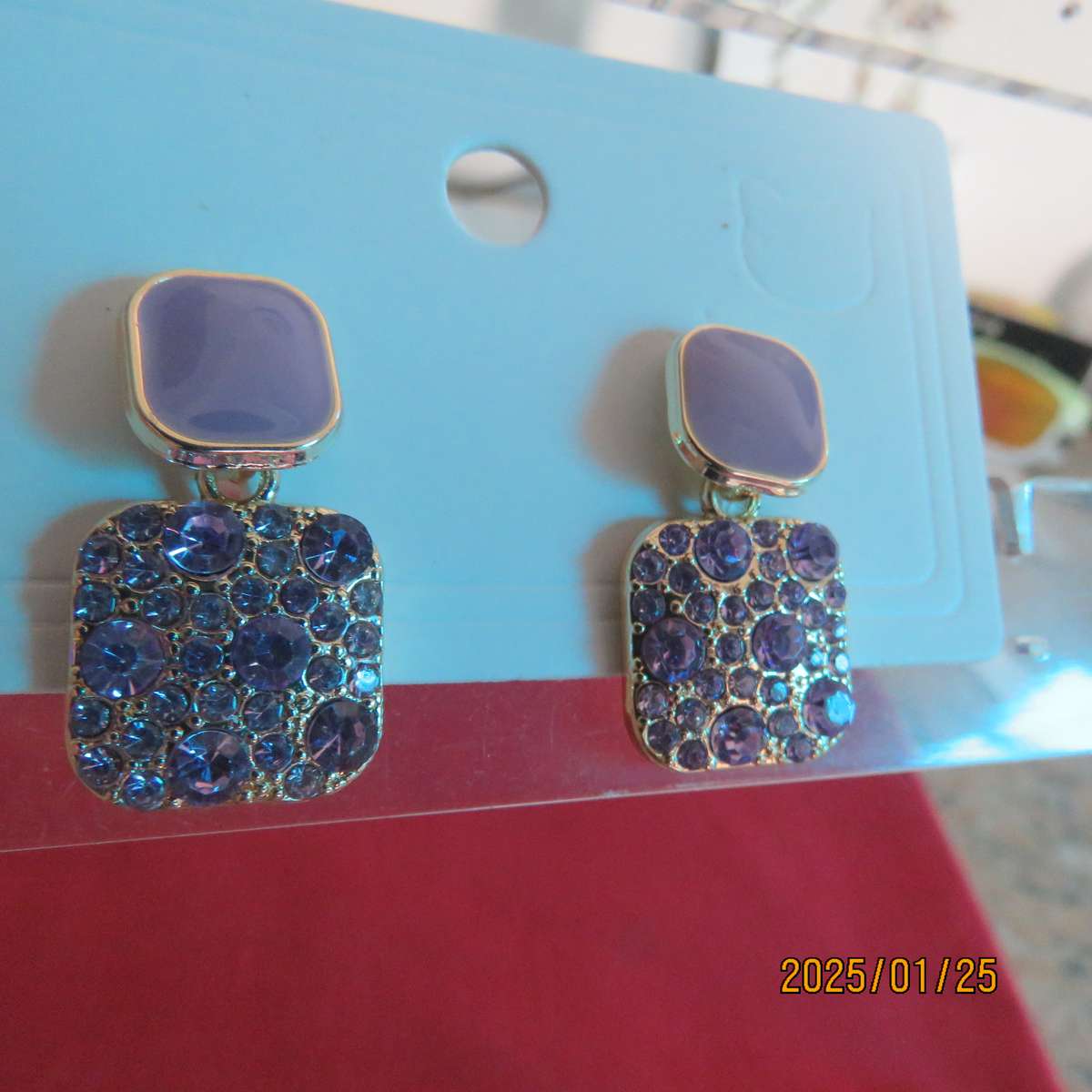 Cute pale violet drop and dangle earrings. Golden with bottom in tiny glimmer stones. New item