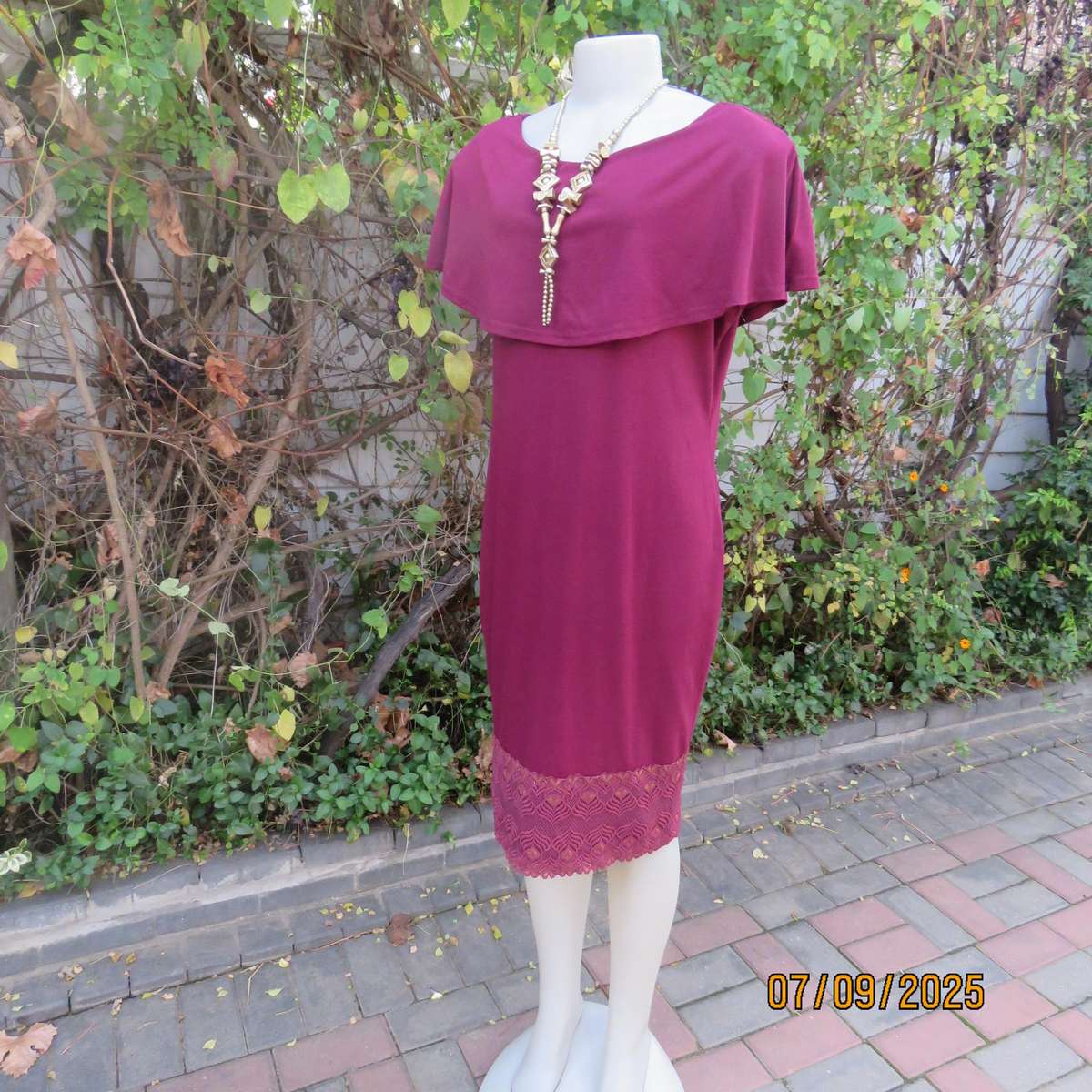 Maroon sleeveless shift dress with wide Bertha collar. Lace hem border. Size 38