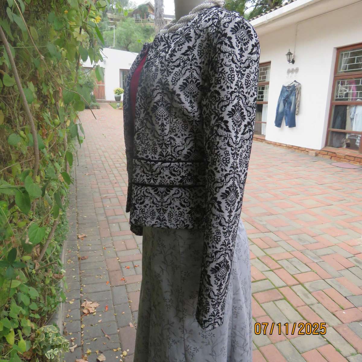 Silver grey stretch polyester long sleeve open elegant jacket.Black velvet baroque embossed. Size 32