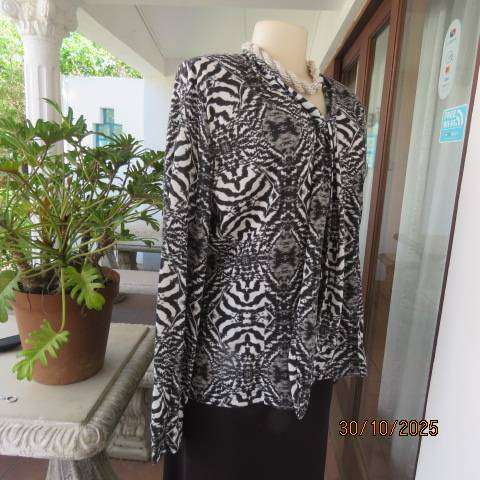 Animal print long sleeve top in black-white-grey. Warm soft polyester. Size 42