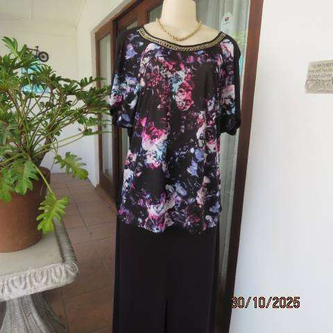Black soft polyester-viscose stretch top with floral front. Chain neck decoration. Size 42