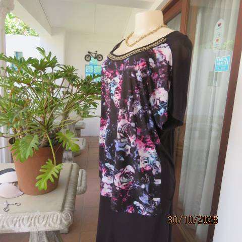 Black soft polyester-viscose stretch top with floral front. Chain neck decoration. Size 42