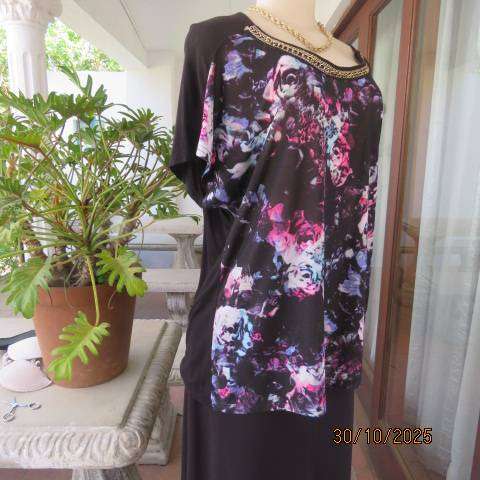 Black soft polyester-viscose stretch top with floral front. Chain neck decoration. Size 42