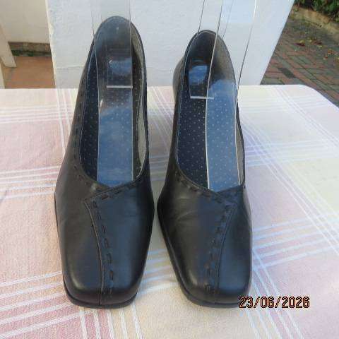 Black ladies low heel formal shoes with leather uppers and square points, size 7