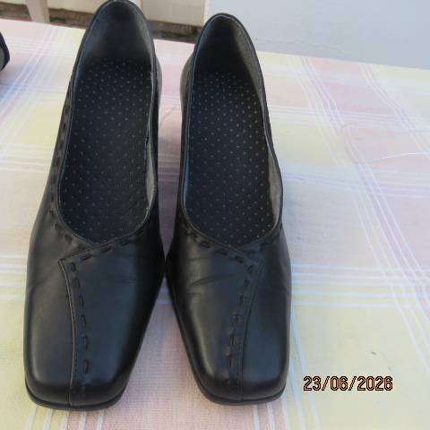 Black ladies low heel formal shoes with leather uppers and square points, size 7