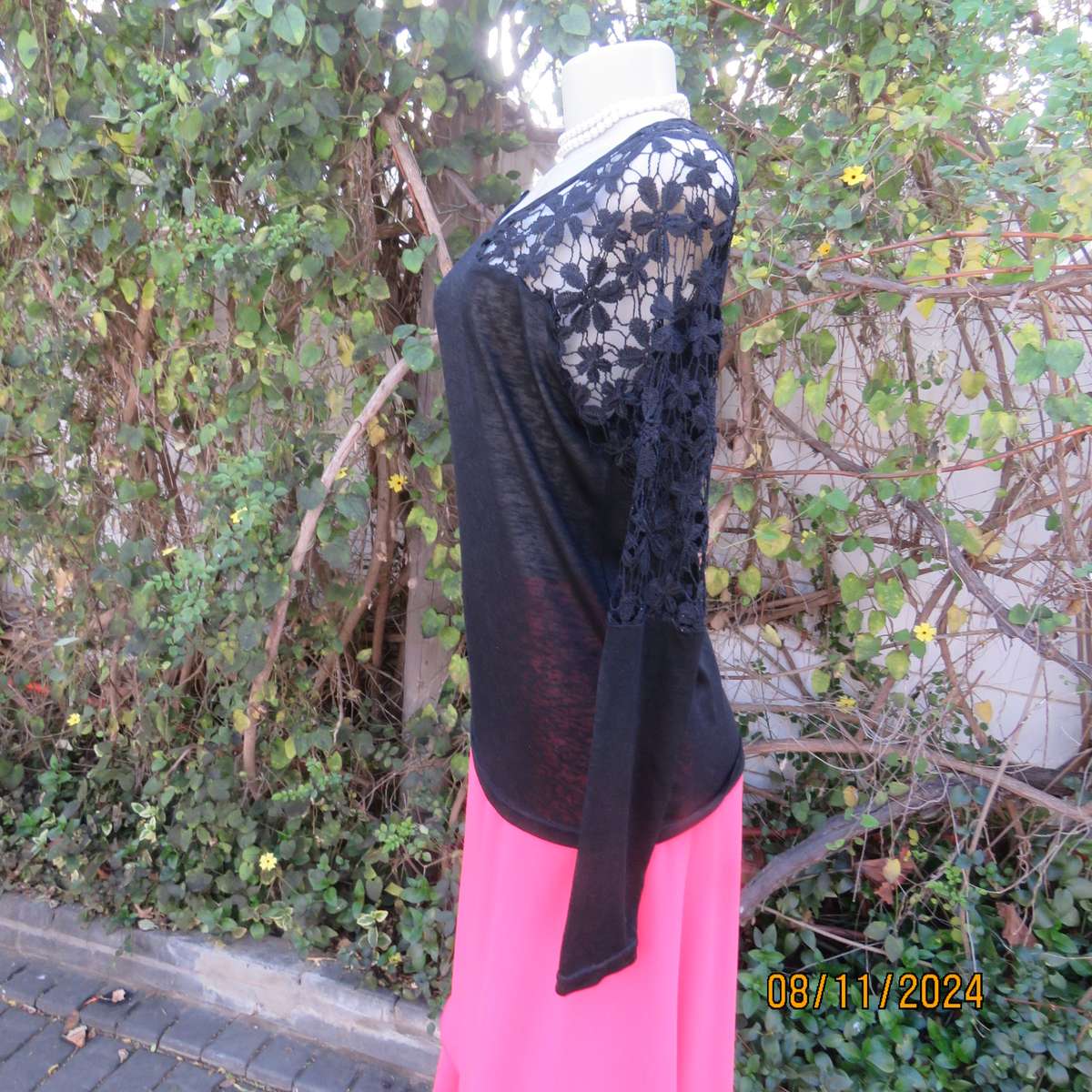 Gorgeous black day/evening wear top. One sleeve partly lace.Other naked shoulder. Size 36.As new